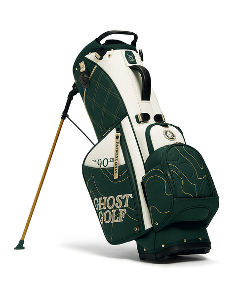 Stand View of Patrons Only Anday Bag with white and green accents and detail topographic pattern with ghost golf branding #color_green