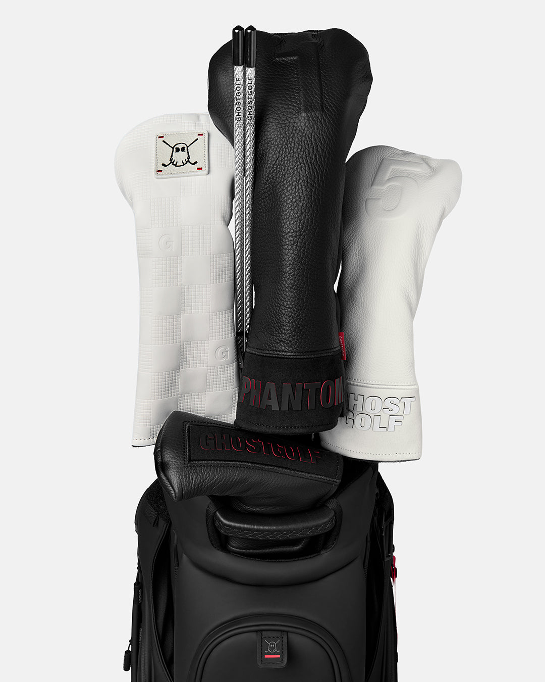Front view of a Silver Golf Alignment Stick stored in a golf bag beside several golf club head covers
#color_silver