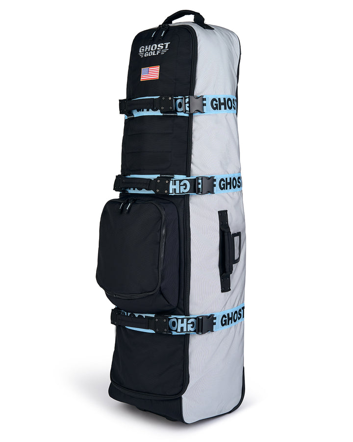 Three-quarter view of the Striker Primary AWOL Travel Bag showcasing Ghost Golf embroidery across the top panel and an embroidered USA flag detail. Angled product image highlighting the bag’s premium construction, travel-ready design, patriotic accents, and signature Ghost Golf craftsmanship. #color_grey