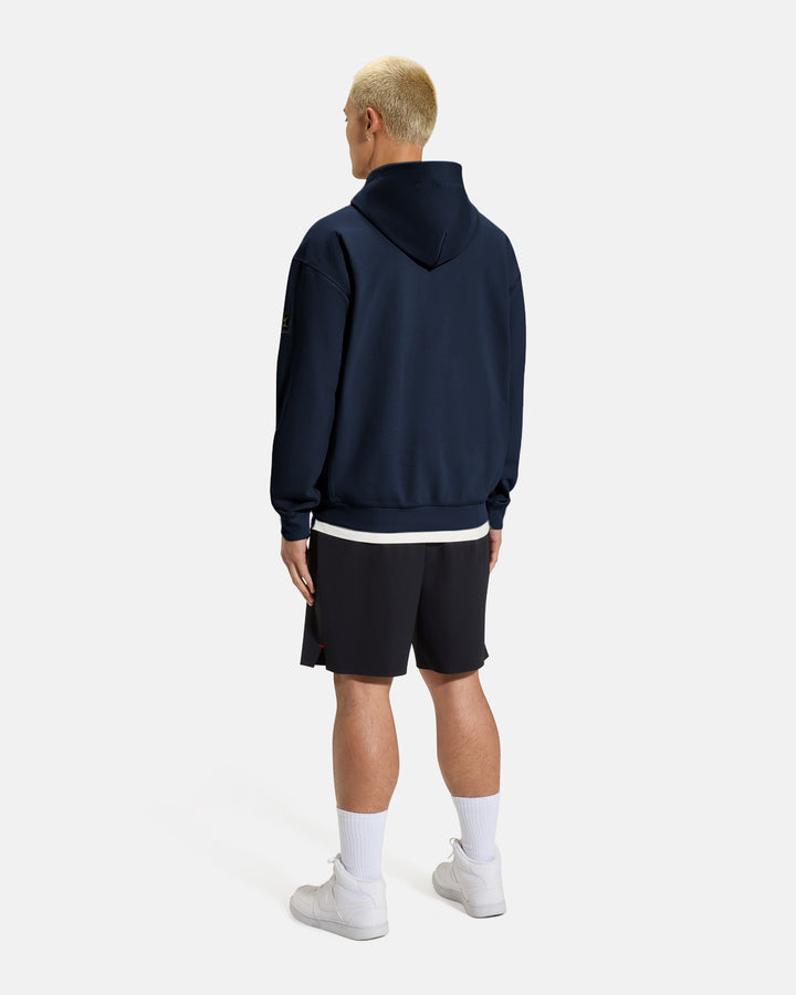 Clubhouse Hoodie_Full Body Back_Navy_Male Model #color_navy