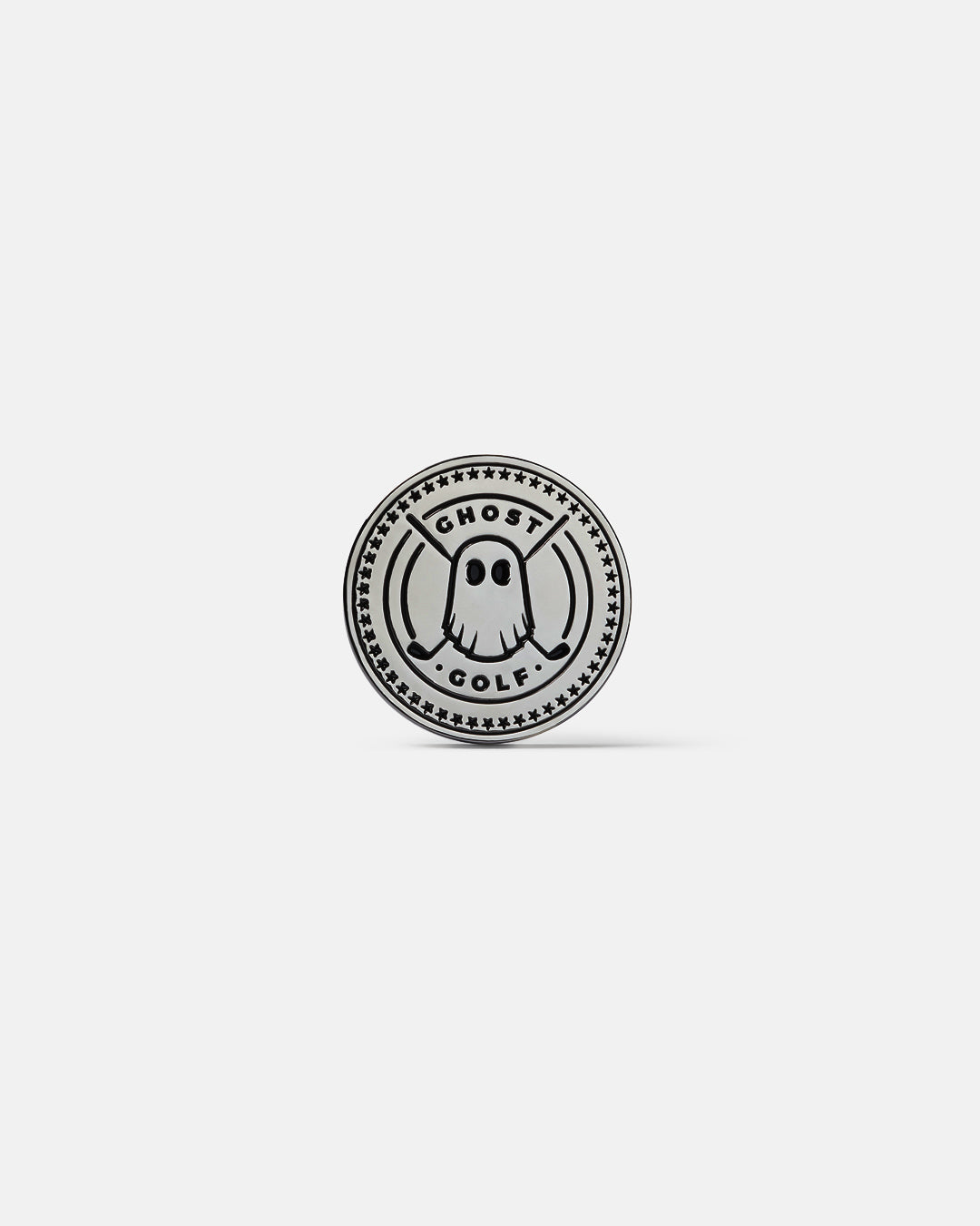 Product photo of a circular silver ball marker featuring the Ghost Golf emblem, with stars forming a full circle around the design.
