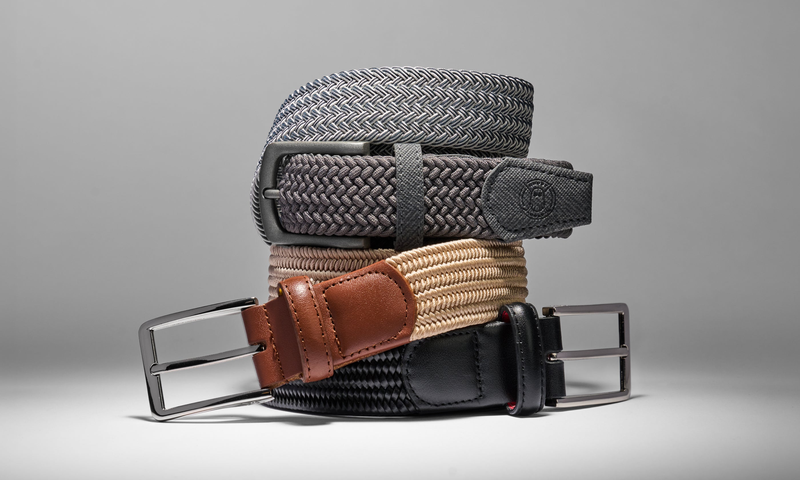 Studio product photo of stacked Ghost Golf golf belts.