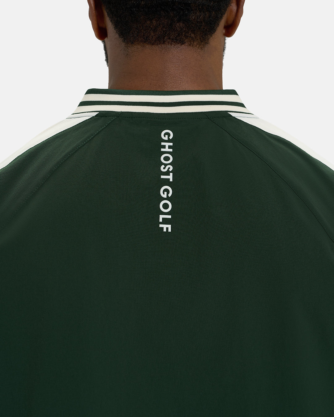 Back Closeup View of Bogey Green Fairway Windshirt V2 on Black Male Model with Ghost Golf #color_bogey-green