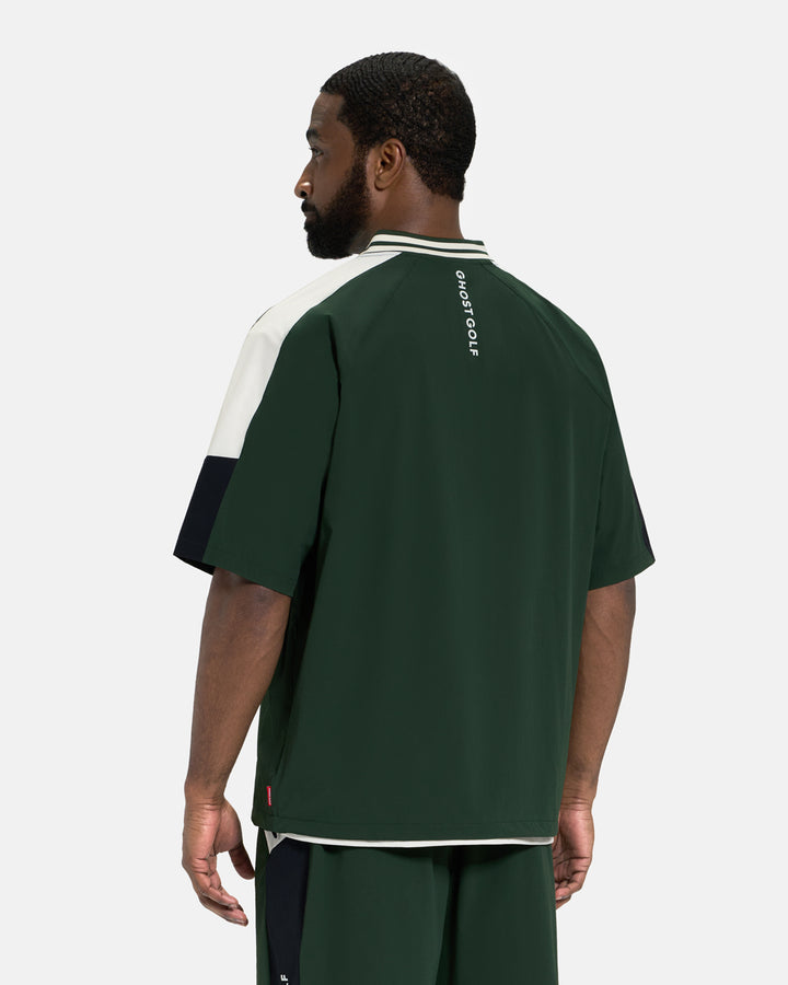 Back View of Bogey Green Fairway Windshirt V2 on Black Male Model #color_bogey-green