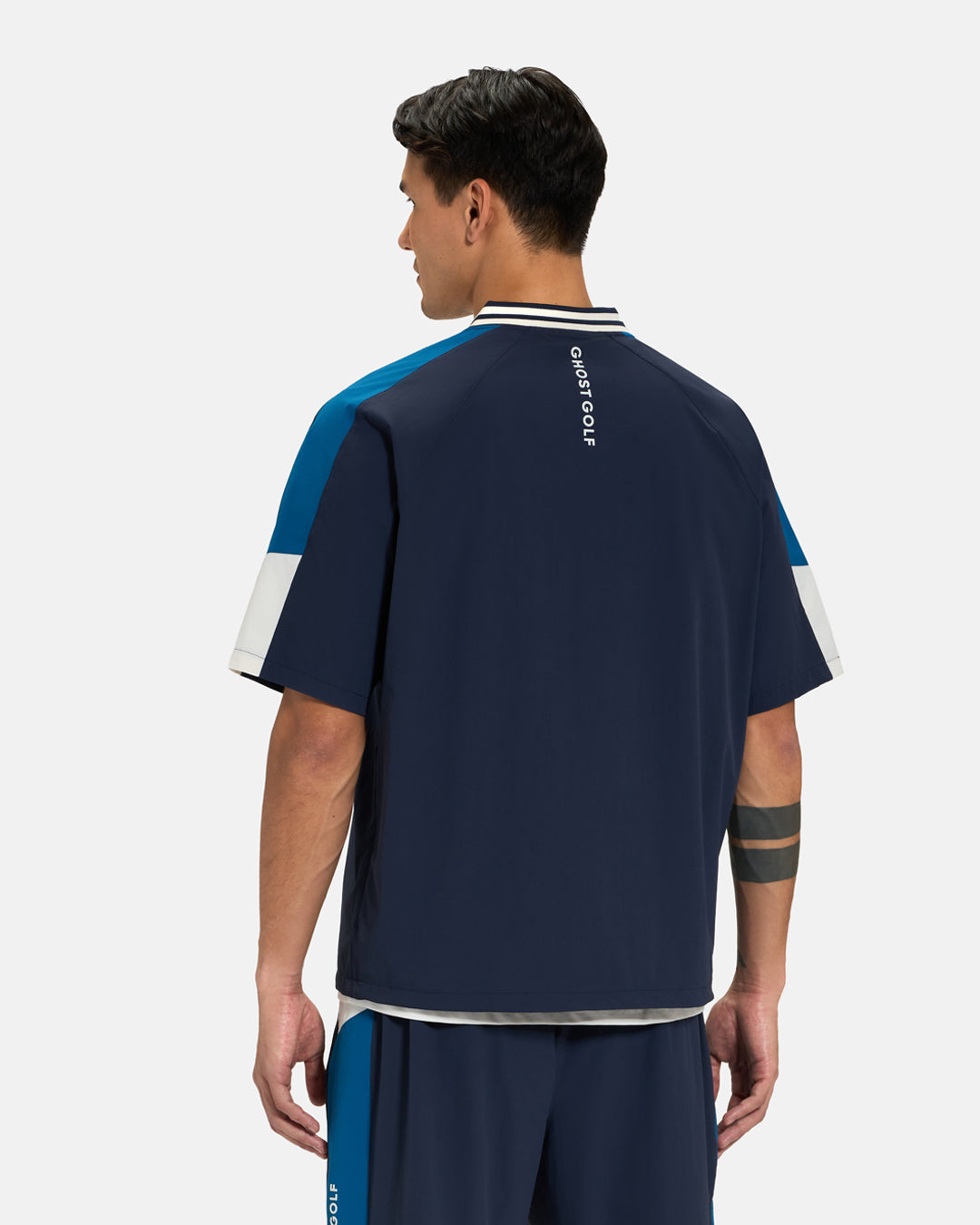 Back View of Navy Fairway Windshirt V2 on Asian Male Model #color_navy