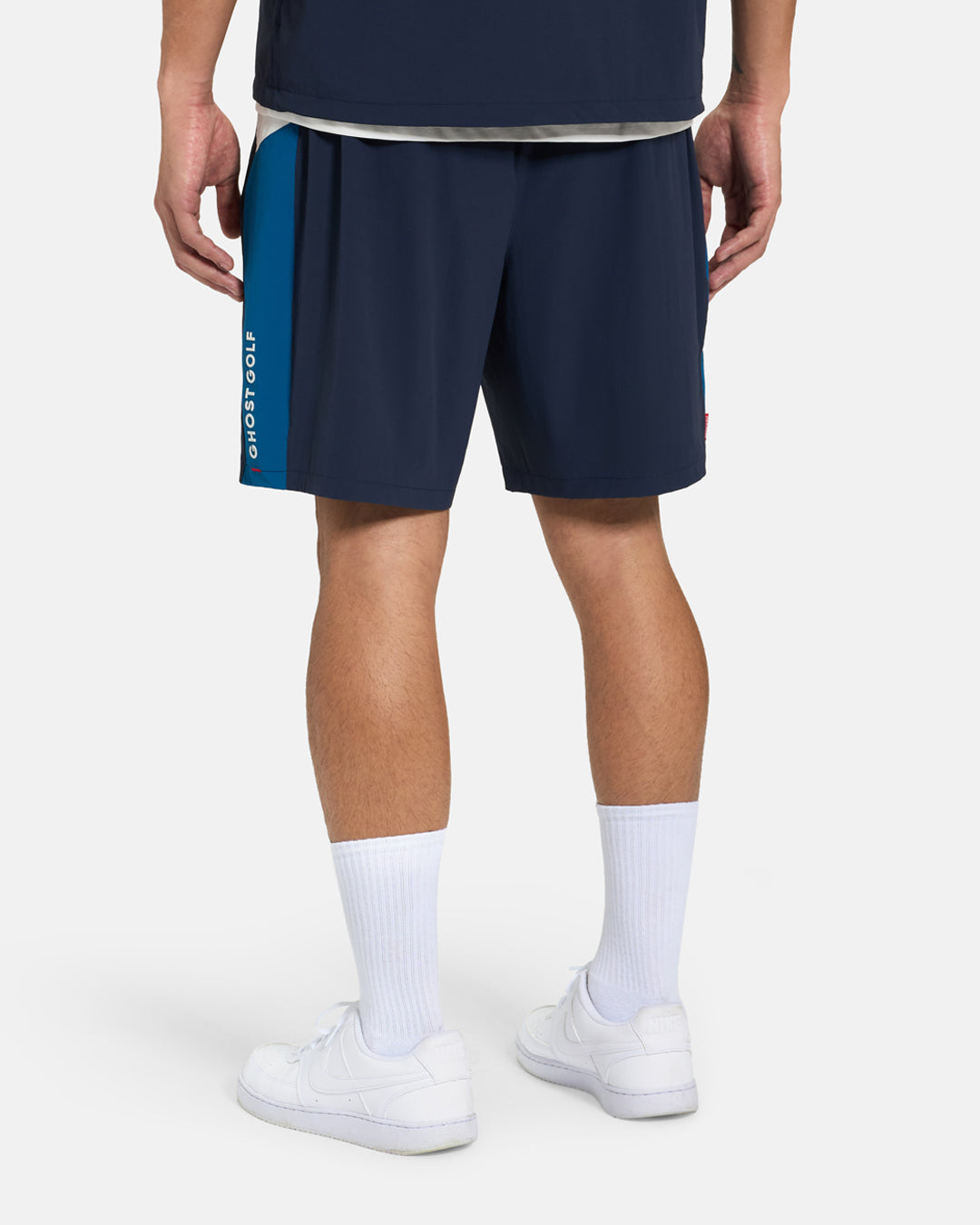 Back View of Navy Fairway Windshort V2 on Asian Male Model #color_navy