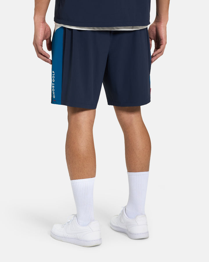 Back View of Navy Fairway Windshort V2 on Asian Male Model #color_navy