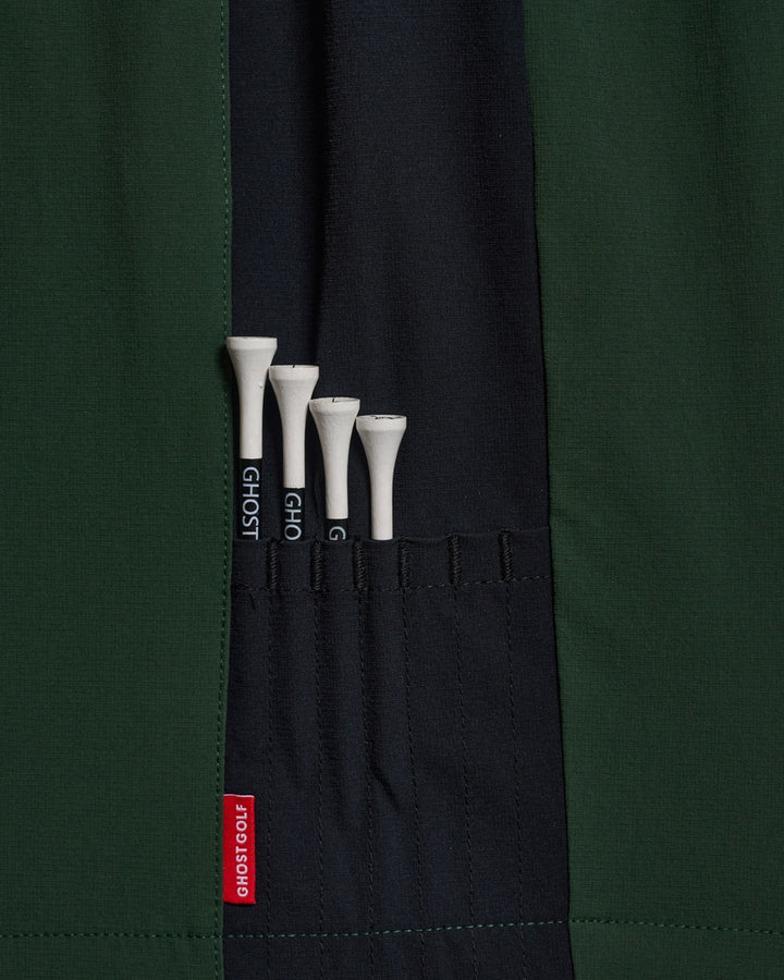 Detail Shot of Bogey Green Fairway Windshort V2 holding golf tees #color_bogey-green