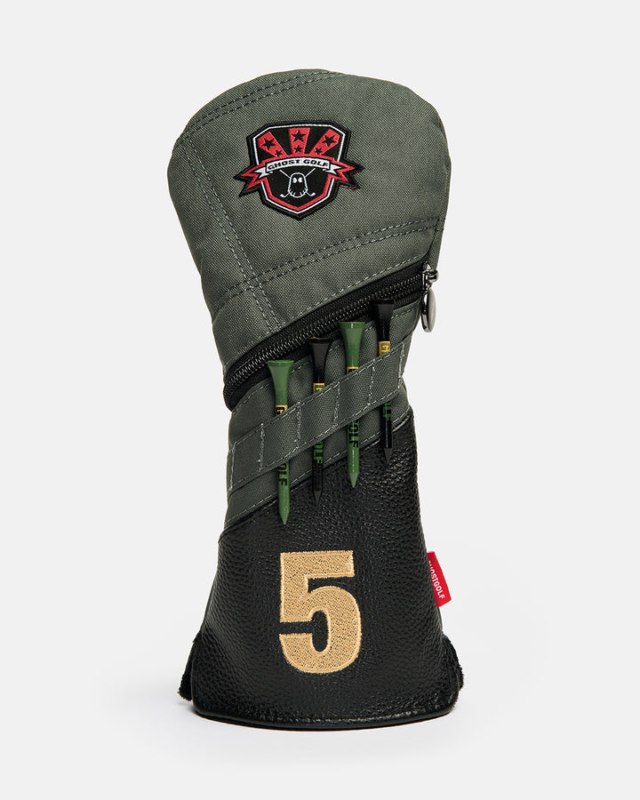 Front product shot of the G-Suit Secondary 5 Wood Head Cover featuring the Ghost Golf logo embroidered at the top and an embroidered number "1" at the bottom. The cover includes integrated golf tee holders on the front, combining functional storage with premium design. Front-facing image highlighting the detailed embroidery, aviation-inspired styling, and signature Ghost Golf craftsmanship. #size_5-wood