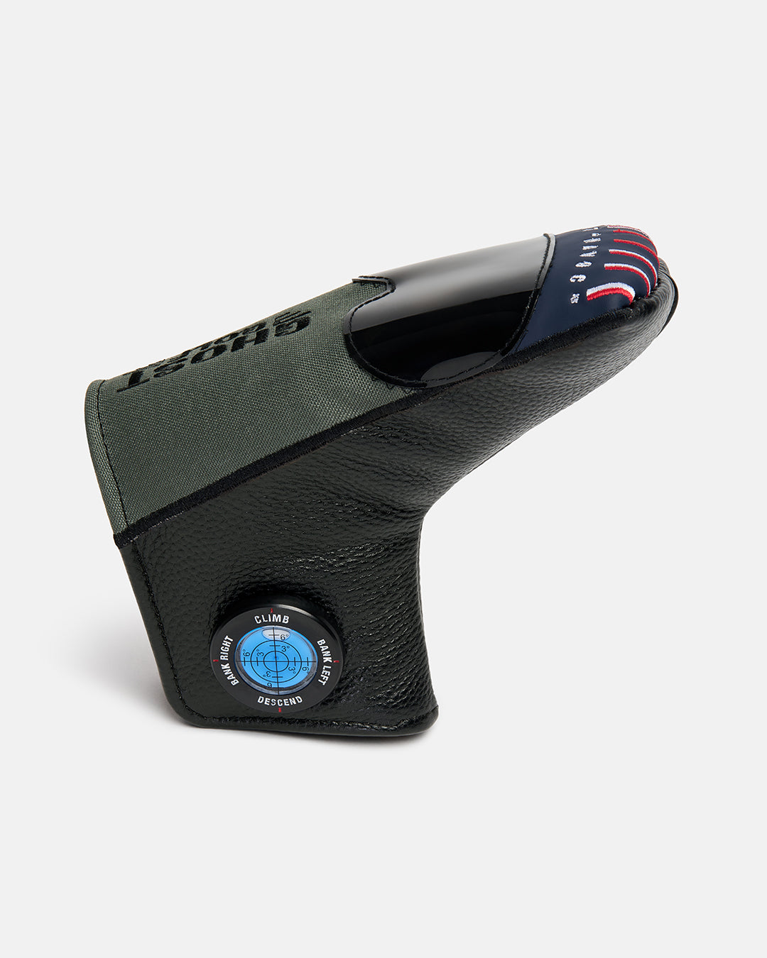 Side product shot of the G-Suit Primary Blade Putter Cover, featuring aviation-inspired compass graphics on the side and Capt Havoc typography embroidered across the top. Angled view highlighting the unique aircraft silhouette, premium embroidery, and signature Ghost Golf military-inspired design details.