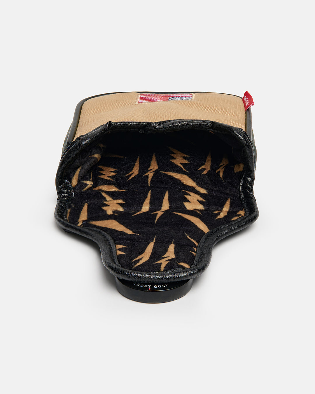 Detail product shot of the G-Suit Secondary Mallet Putter Cover showcasing the interior lining with a lightning bolt pattern. Close-up image highlighting the premium materials, protective padded construction, and unique aviation-inspired design details inside the cover.