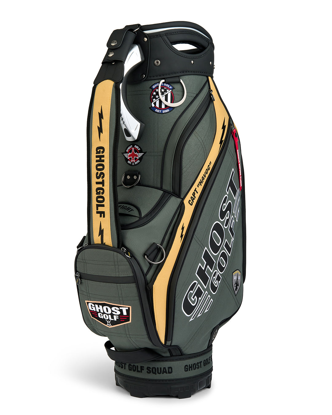 Three-quarter view of the G-Suit Staff Bag showcasing prominent Ghost Golf logo branding and a collection of military aviation-inspired patches. Angled product image highlighting the bag’s premium construction, patriotic design elements, custom embroidered details, and signature Ghost Golf styling. Showing Shoulder Strap