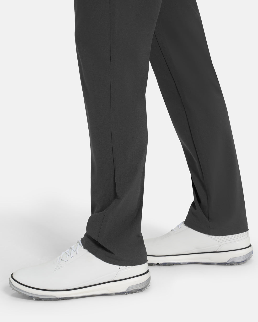 Bottom Closeup Side View of Iron Grey Ghost Golf Core 5 Pocket Pant on White male Model #color_iron-grey