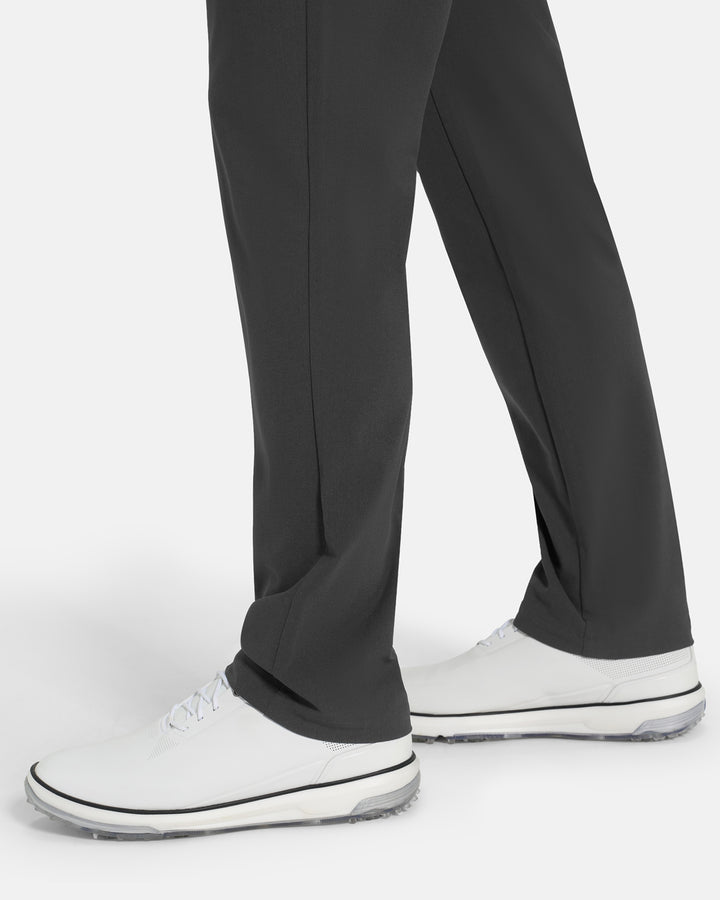 Bottom Closeup Side View of Iron Grey Ghost Golf Core 5 Pocket Pant on White male Model #color_iron-grey