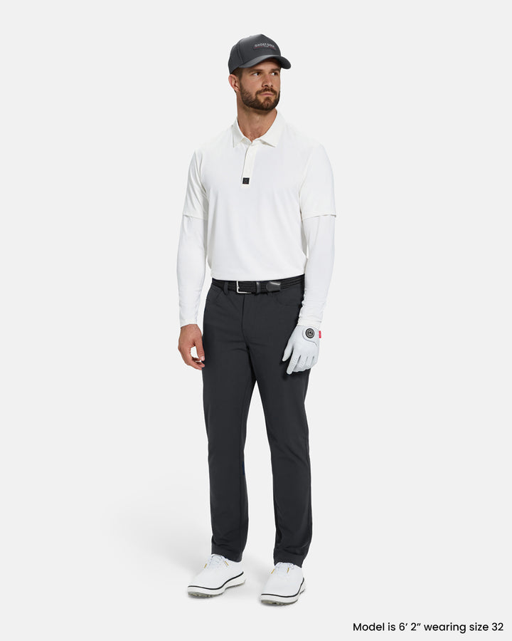 Full Body Front View of BIron Grey Ghost Golf Core 5 Pocket Pant on White Male Model wearing white polo black belt grey hat white glove and white shoes #color_iron-grey