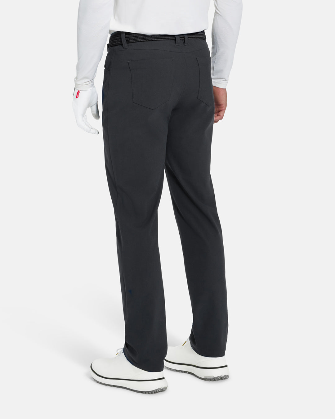 Back View of Iron Grey Ghost Golf Core 5 Pocket Pant on White Male Model with white shoes #color_iron-grey