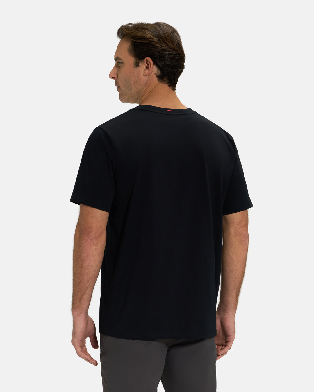 Back View of Black Ghost Golf Core Logo Tee on White Male Model #color_black