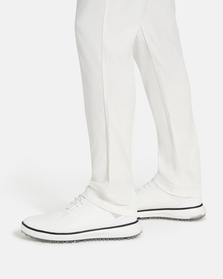 Bottom Closeup Side View of White Ghost Golf Core Pant on White male Model #color_white