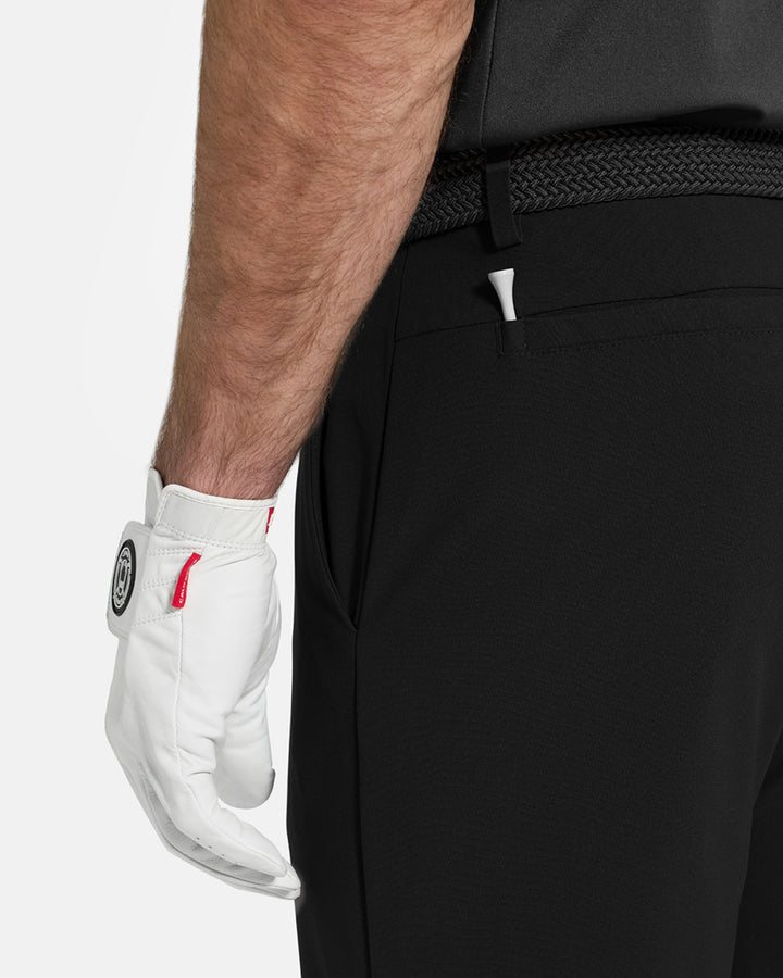 Back Closeup View of Black Ghost Golf Core Pant on White Male Model #color_black