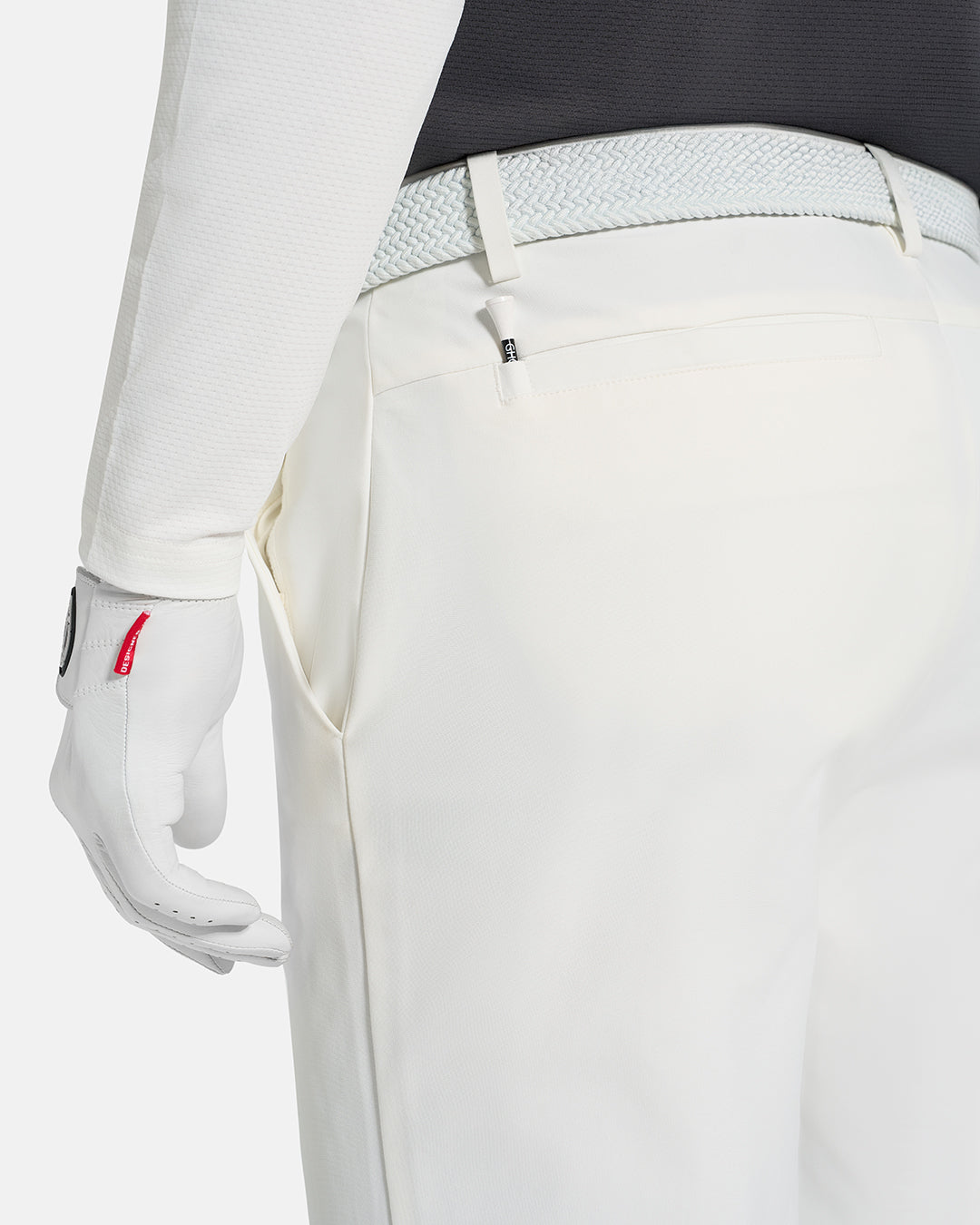 Closeup Back View of White Ghost Golf Core Pant on White Male Model #color_white