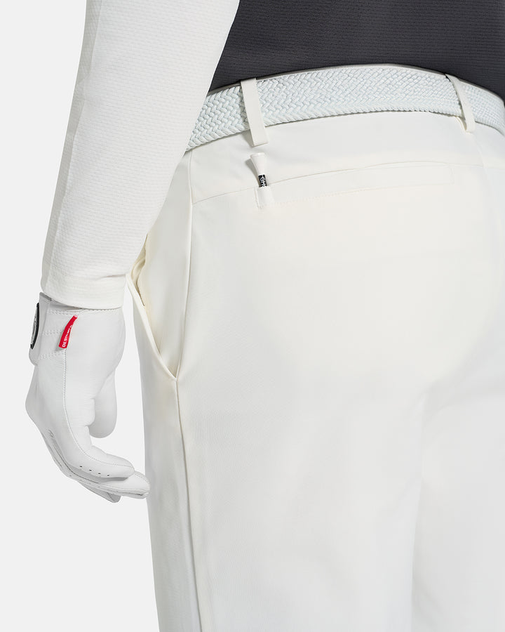Closeup Back View of White Ghost Golf Core Pant on White Male Model #color_white