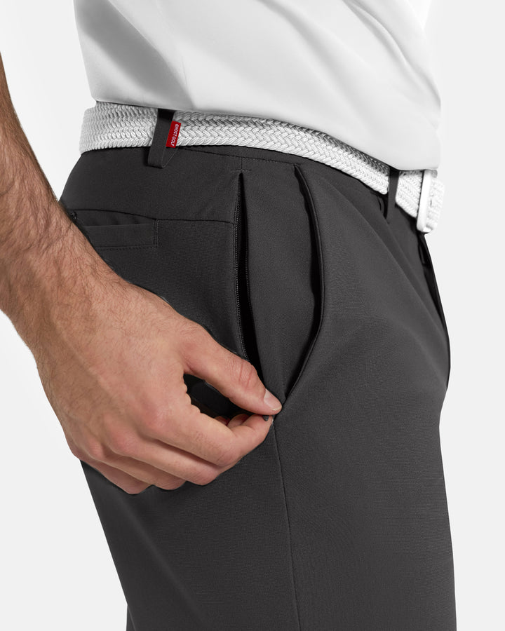 Closeup Side View of Iron Grey Ghost Golf Core Pant on White Male Model pulling down side zipper #color_iron-grey