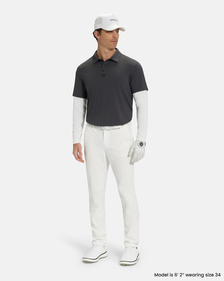Full Body Front View of White Ghost Golf Core Pant on White Male Model wearing grey polo white belt white glove and white shoes #color_white
