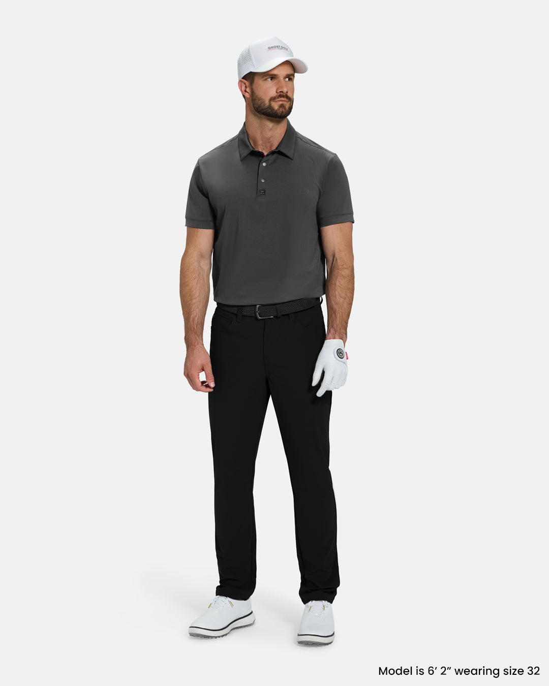 Full Body View of Black Ghost Golf Core Pant on White Male Model wearing grey polo white gloves black belt white shoes and black hat #color_black