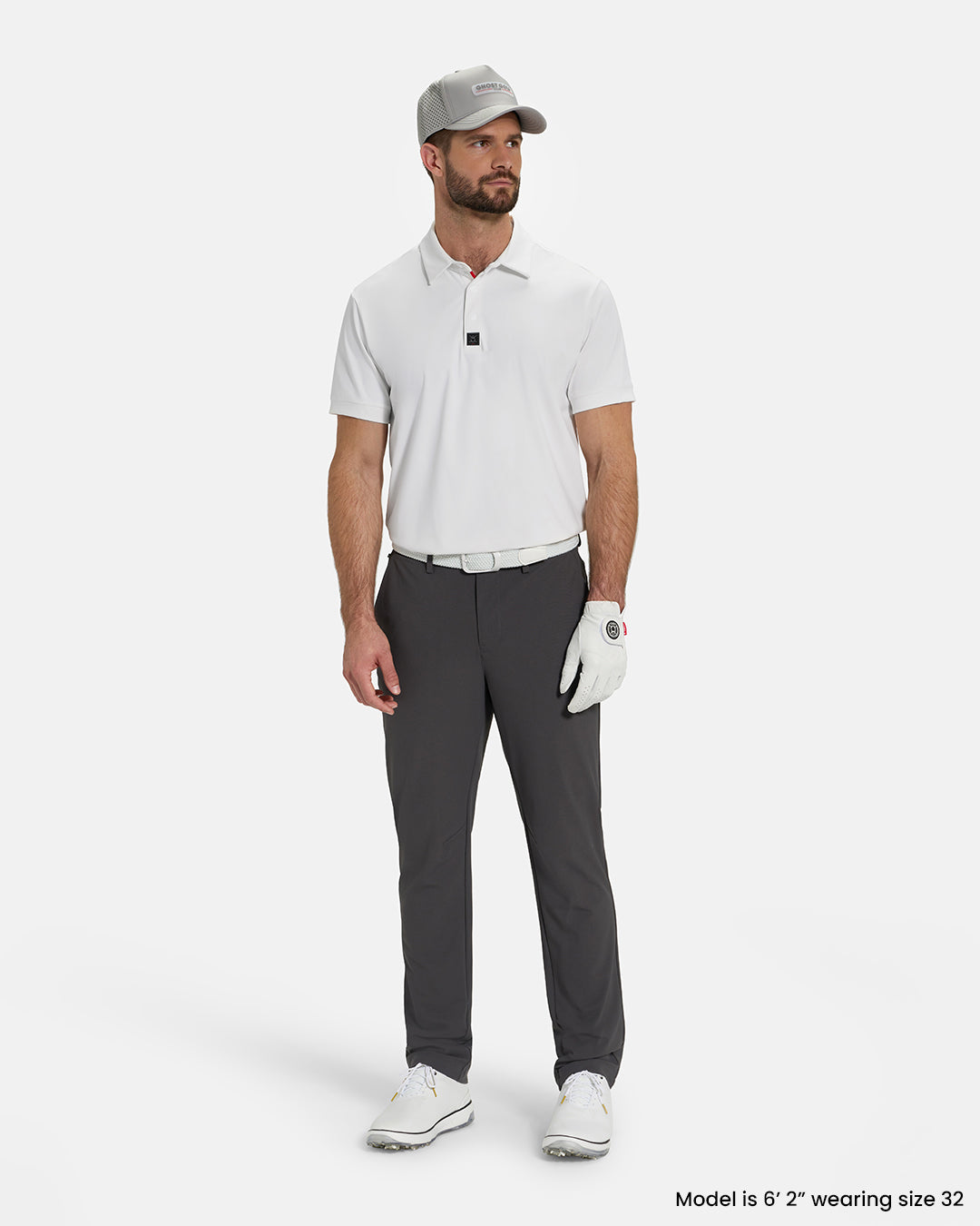 Full Body View of Iron Grey Ghost Golf Core Pant on White Male Model wearing white polo white gloves white belt white shoes and grey hat #color_iron-grey