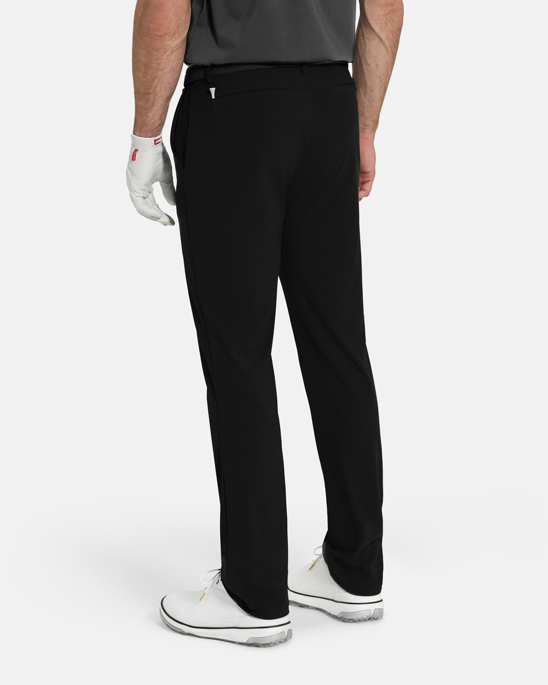 Back View of Black Ghost Golf Core Pant on White Male Model with White Shoes #color_black