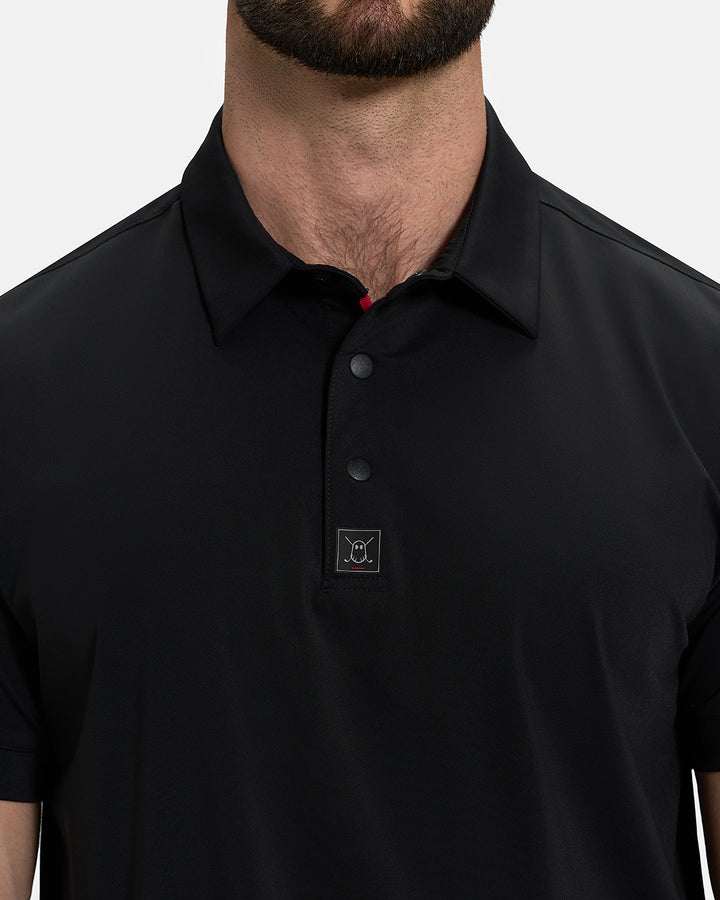 Front Closeup View of Black Ghost Golf Core Polo on White Male Model #color_black