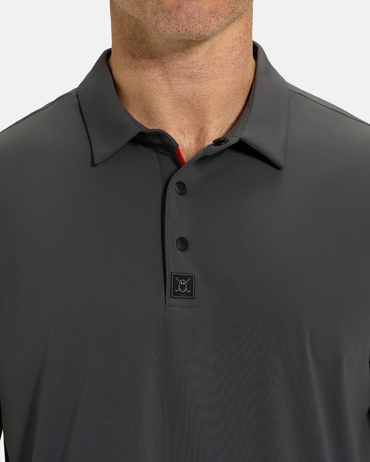 Front Closeup View of Iron Grey Ghost Golf Core Polo on White Male Model #color_iron-grey
