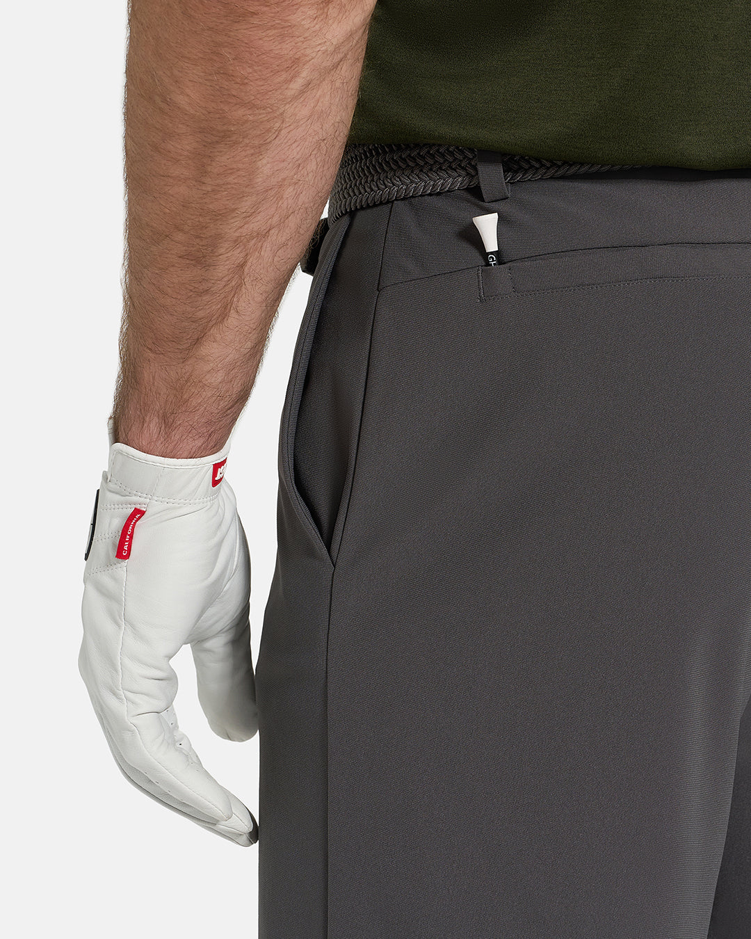 Side Closeup View of Iron Grey Ghost Golf Core Short on White Male Model with hand in pocket #color_iron-grey