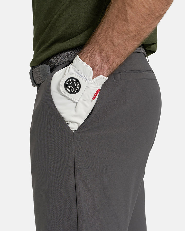 Side Closeup View of Iron Grey Ghost Golf Core Short on White Male Model with hand in pocket #color_iron-grey