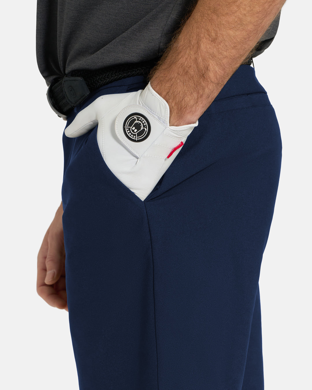 Closeup Side View of Navy Ghost Golf Core Short on White Male Model with hand in pocket #color_navy