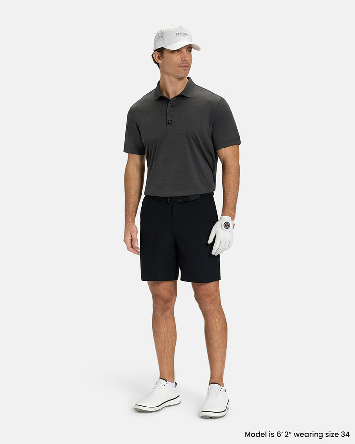 Full Body View of Black Ghost Golf Core Short on White Male Model wearing grey polo white gloves black belt white shoes and white hat #color_black
