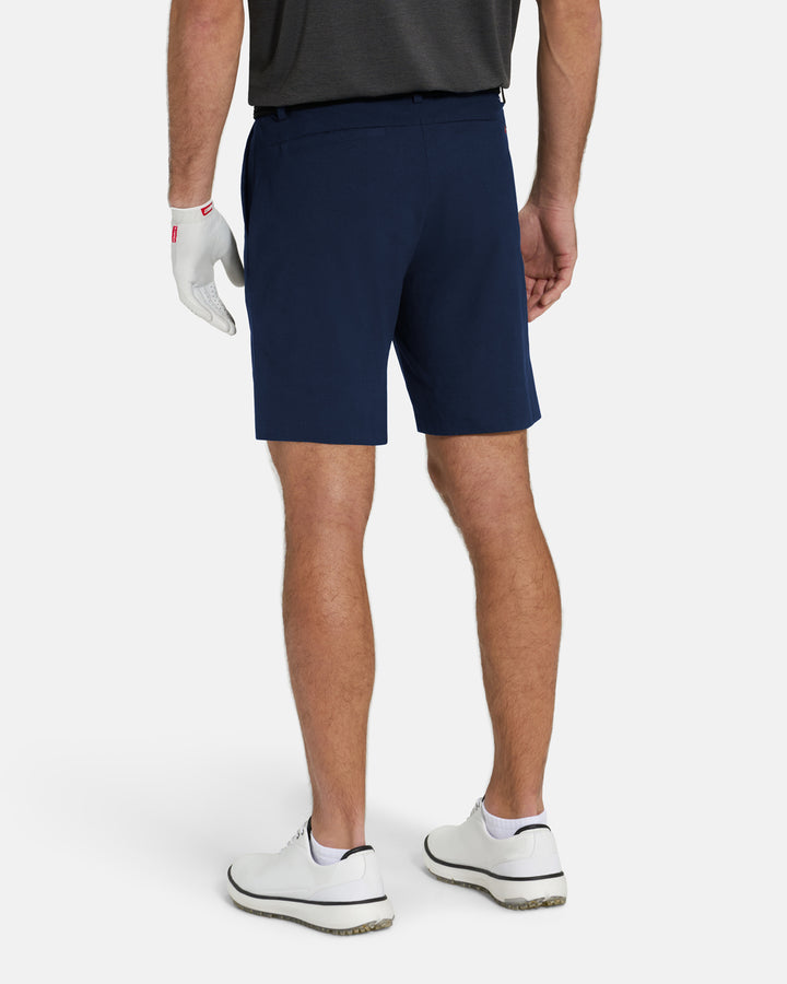 Back View of Navy Ghost Golf Core Short on White Male Model #color_navy