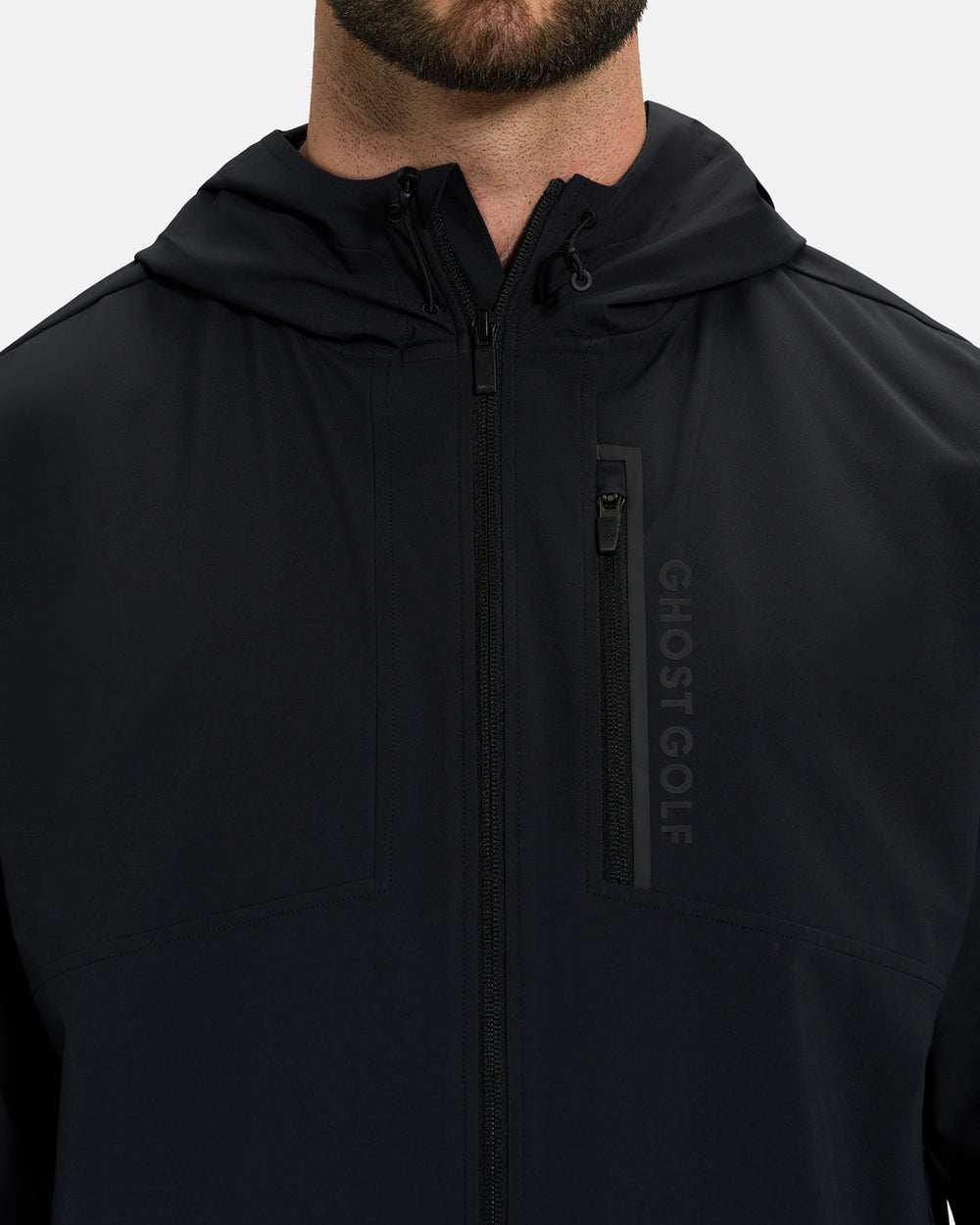 Closeup Front View of Black Ghost Golf Hooded Zip Shell Jacket on White Male Model with ghost golf #color_black