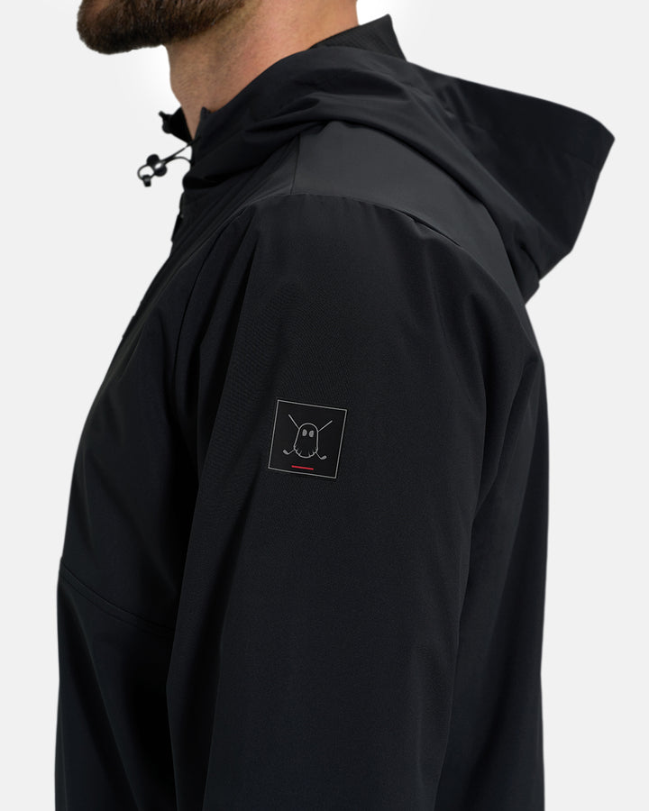 Side Closeup View of Black Ghost Golf Hooded Zip Shell Jacket with Ghost Golf Icon on White Male Model #color_black