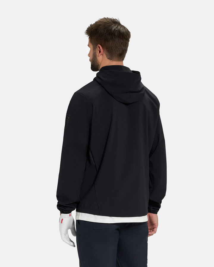 Back View of Black Ghost Golf Hooded Zip Shell Jacket on White Male Model wearing white glove and black pants #color_black
