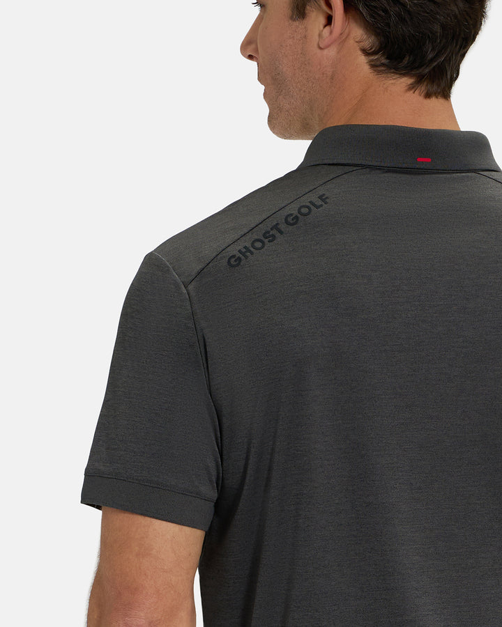 Back Closeup View of Iron Grey Ghost Golf Marled Core Polo with Ghost Golf Logo on White Male Model #color_iron-grey