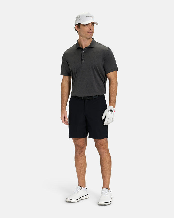 Full Body View of Iron Grey Ghost Golf Marled Core Logo Tucked on White Male Model wearing black shorts white gloves black belt white shoes and white hat #color_iron-grey