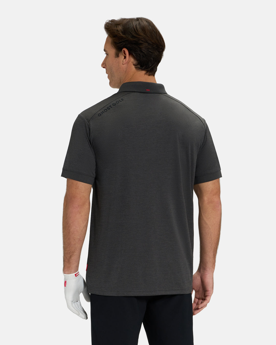 Back View of Iron Grey Ghost Golf Marled Core Polo  Untucked on White Male Model with Ghost Golf logo on back #color_iron-grey