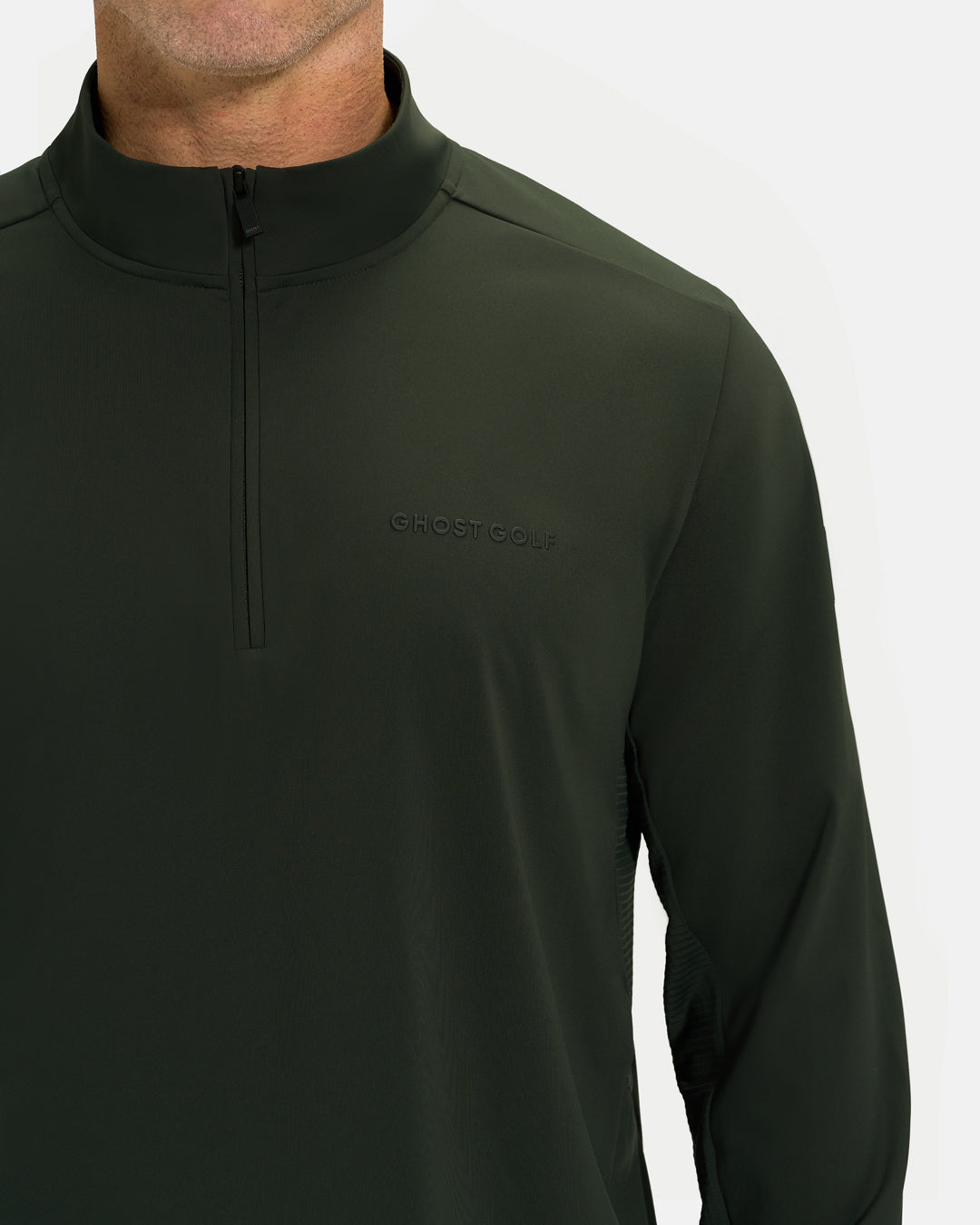 Closeup Front View of Forest Green Ghost Golf Quarter Zip Mock Jacket on White Male Model #color_forest-green