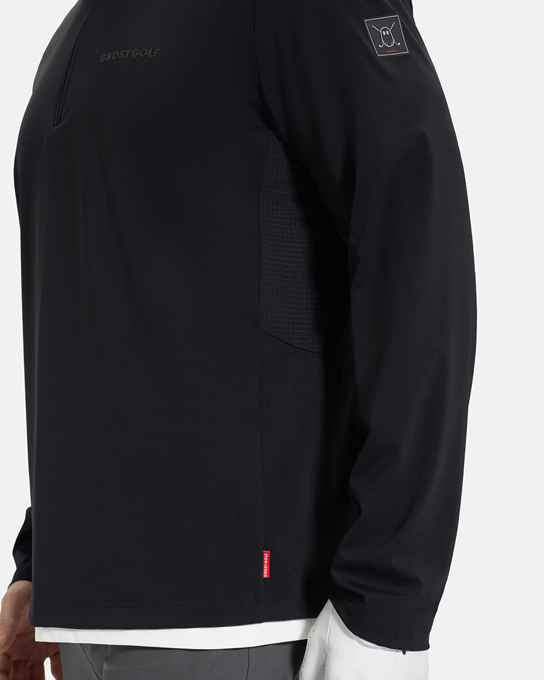 Side Closeup View of Black Ghost Golf Quarter Zip Mock Jacket with Ghost Golf Logo on White Male Model #color_black