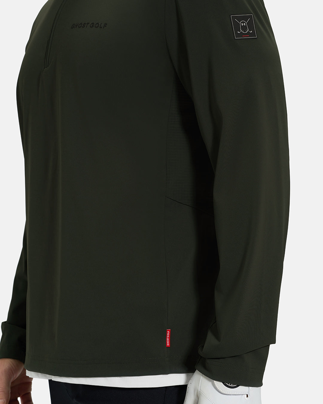 Side Closeup View of Forest Green Ghost Golf Quarter Zip Mock Jacket with Ghost Golf Logo on White Male Model #color_forest-green