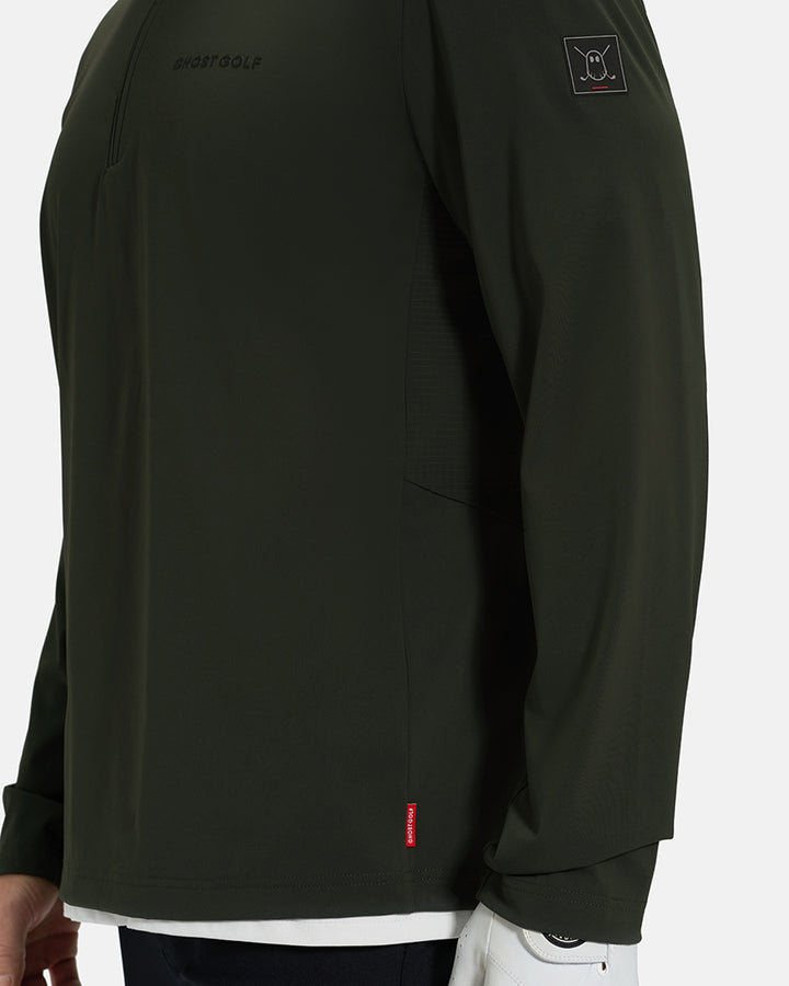 Side Closeup View of Forest Green Ghost Golf Quarter Zip Mock Jacket with Ghost Golf Logo on White Male Model #color_forest-green
