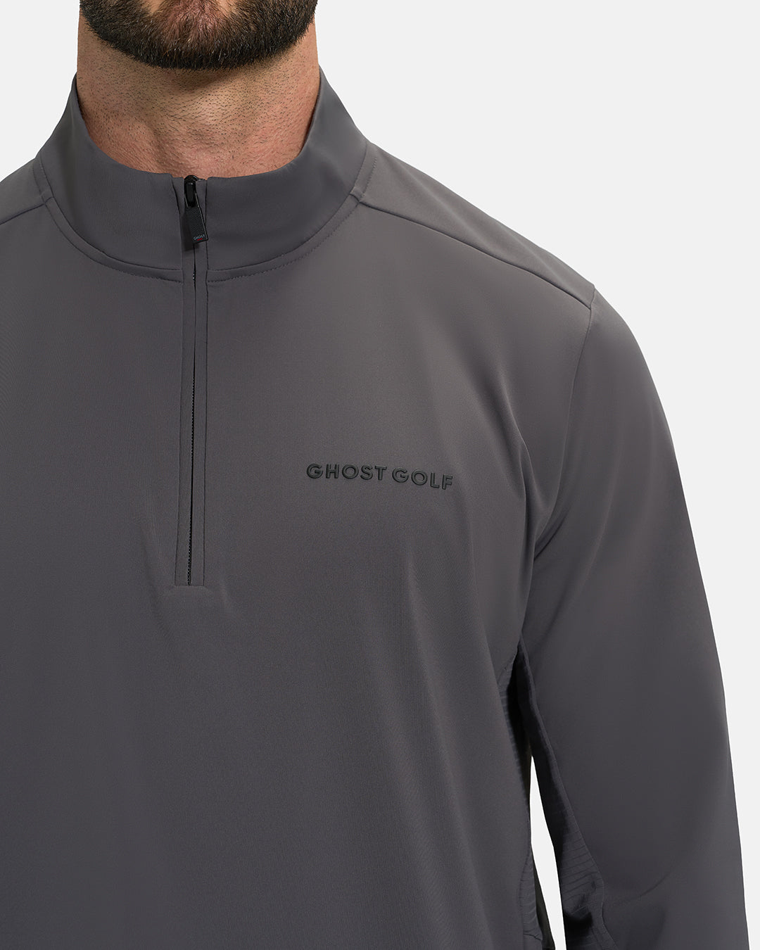 Front Closeup View of Iron Grey Ghost Golf Quarter Zip Mock Jacket with Ghost Golf Logo on White Male Model #color_iron-grey
