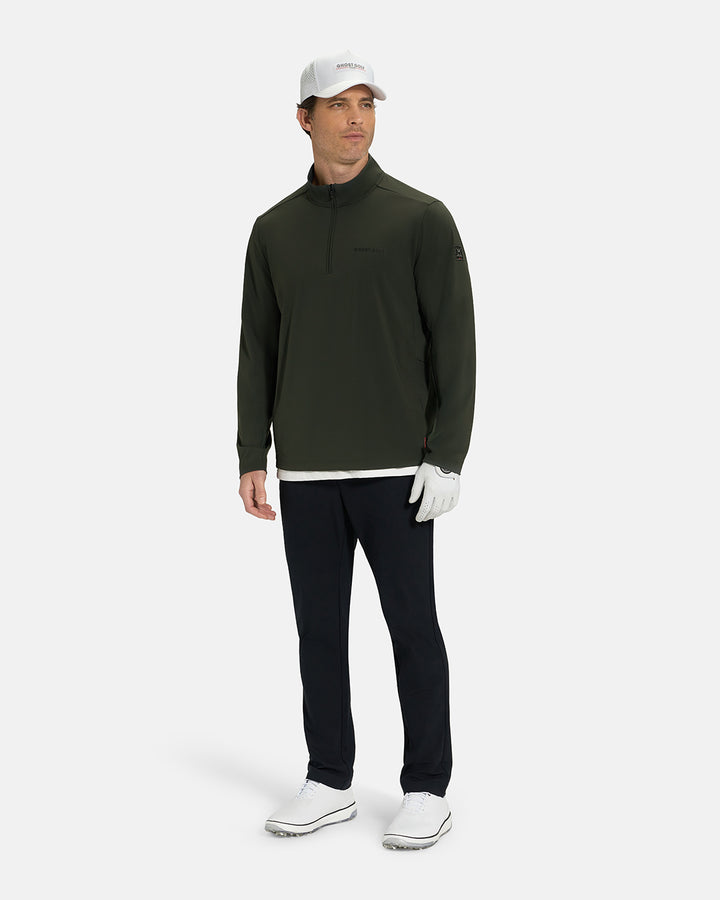 Full Body View of Forest Green Ghost Golf Quarter Zip Mock Jacket on White Male Model wearing black pants white glove white hat white shoes and white tee #color_forest-green