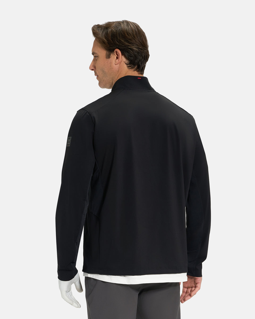 Back View of Black Ghost Golf Quarter Zip Mock Jacket on White Male Model #color_black